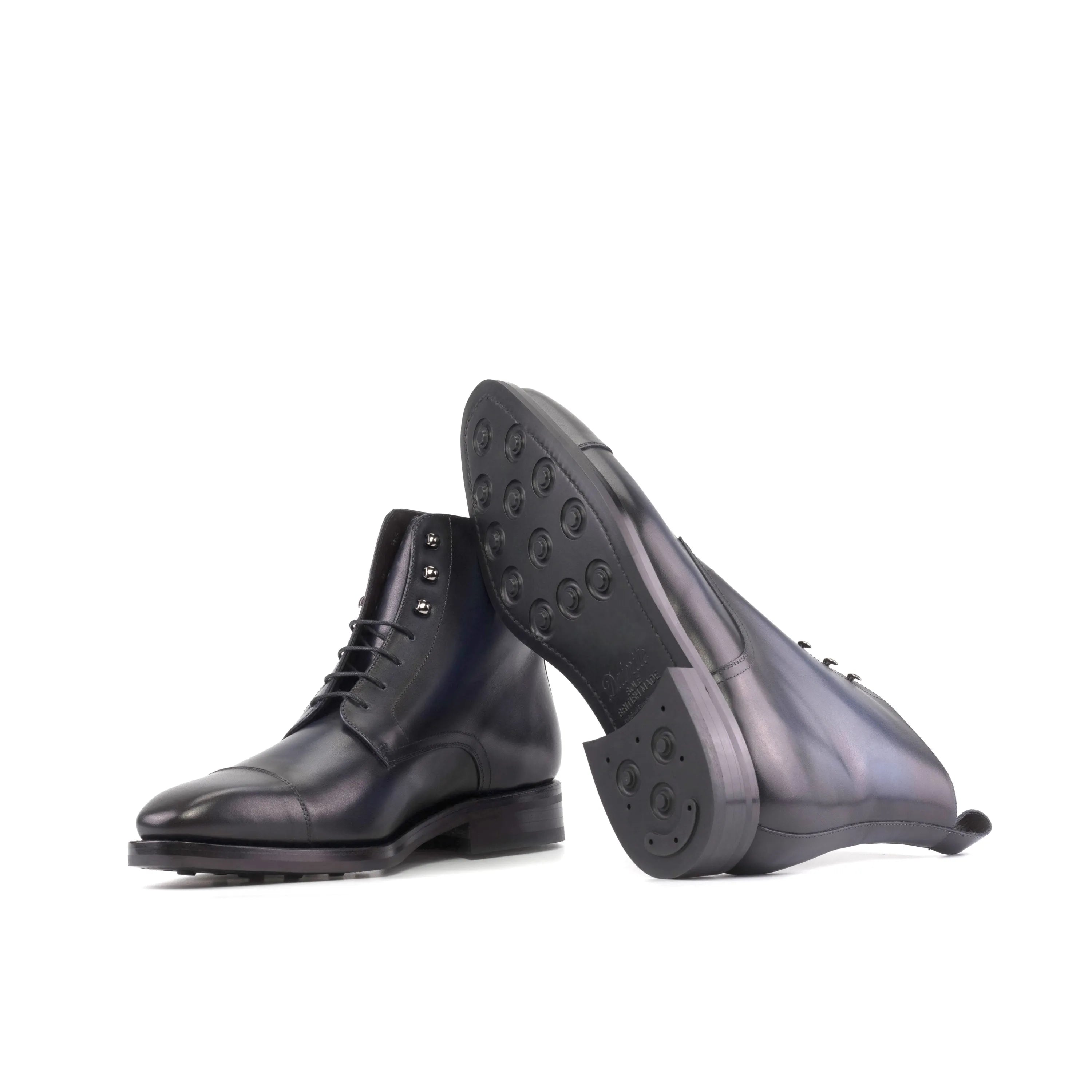 Pair of black leather Yarcin Jumper Boots showcasing classic and elegant design
