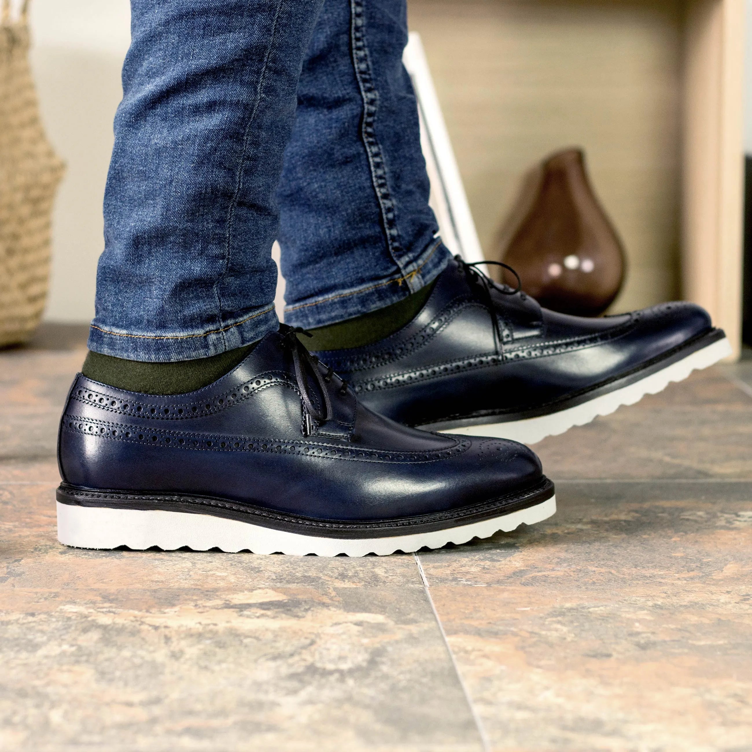 Blue leather longwing blucher shoes featuring a classic wingtip design