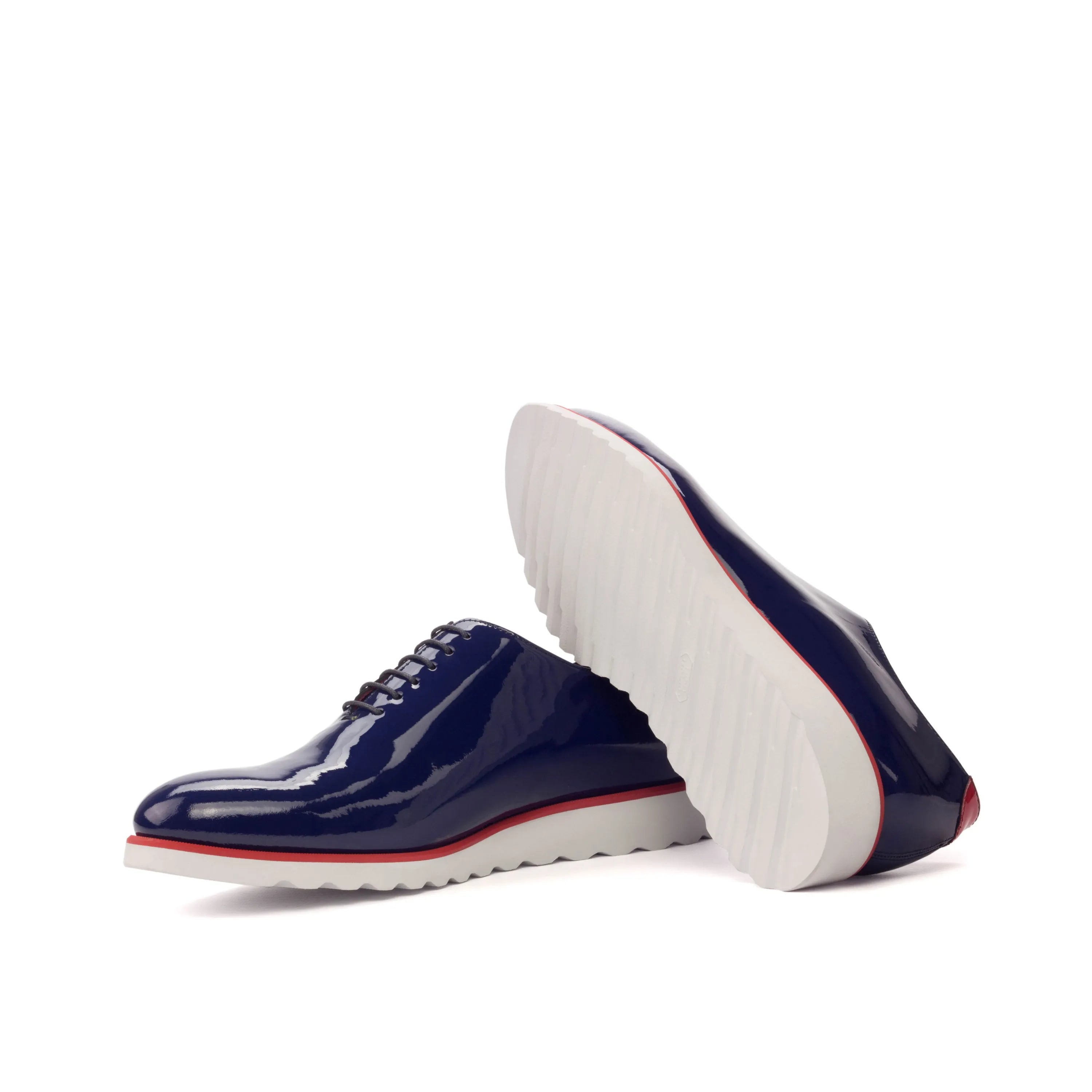Shiny navy blue Zaid Wholecut shoes featuring a sleek and elegant design
